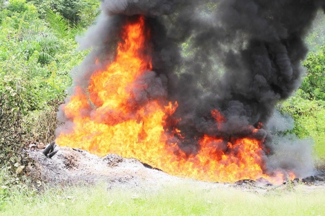 Oil pipeline fire with black smoke